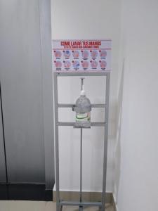 a drink machine with a bottle of water on it at Hotel Aguazul Plaza Centro in Aguazul
