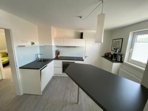 Kuchyň nebo kuchyňský kout v ubytování Design Fewo am Harz