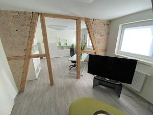 TV a/nebo společenská místnost v ubytování Design Fewo am Harz