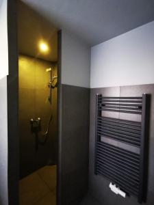 a bathroom with a shower with a shower curtain at Hotel Engelsburg - Apartments in Remscheid