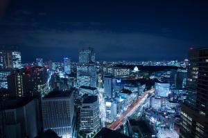 a view of a city at night at ANA InterContinental Tokyo by IHG in Tokyo
