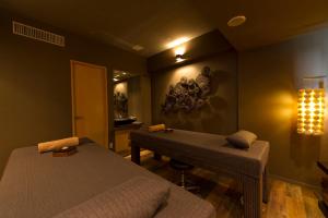 a room with two beds and a desk in it at ANA InterContinental Tokyo by IHG in Tokyo
