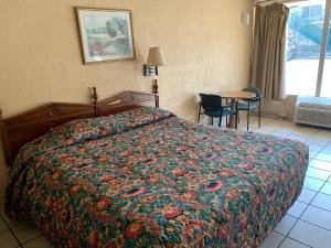 Postel nebo postele na pokoji v ubytování Budget Inn Motel