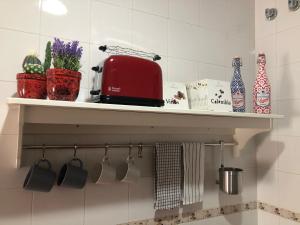 Kuchyň nebo kuchyňský kout v ubytování Apartamento Ocuri