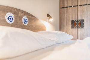 A bed or beds in a room at Hotel Resort Relax