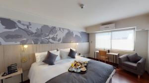 Ένα ή περισσότερα κρεβάτια σε δωμάτιο στο Hotel Brasilia +32 φωτογραφίες