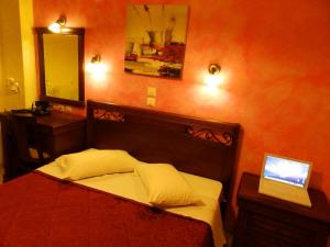 Postel nebo postele na pokoji v ubytování Pergamos Hotel