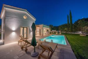 The swimming pool at or close to Ionian Trilogy Luxury Villas