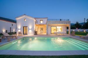 The swimming pool at or close to Ionian Trilogy Luxury Villas