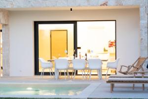 The swimming pool at or close to Ionian Trilogy Luxury Villas