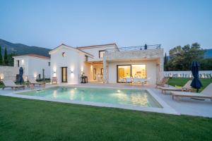 The swimming pool at or close to Ionian Trilogy Luxury Villas