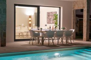 The swimming pool at or close to Ionian Trilogy Luxury Villas