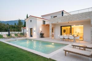 The swimming pool at or close to Ionian Trilogy Luxury Villas