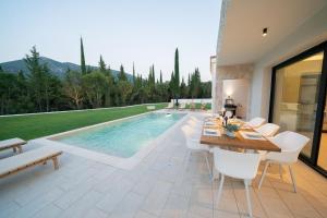 The swimming pool at or close to Ionian Trilogy Luxury Villas