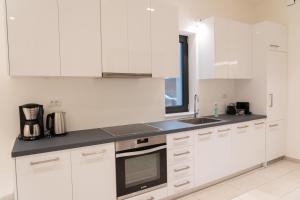 A kitchen or kitchenette at Ionian Trilogy Luxury Villas