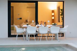 The swimming pool at or close to Ionian Trilogy Luxury Villas