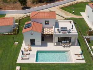 The swimming pool at or close to Ionian Trilogy Luxury Villas