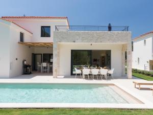 The swimming pool at or close to Ionian Trilogy Luxury Villas