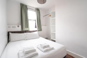 Llit o llits en una habitació de H.V Apartments