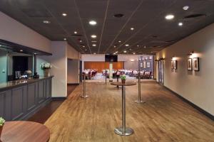 a restaurant with tables and a bar in a room at The Milner York in York