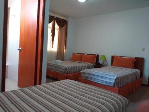 Hotel Samuria客房内的一张或多张床位