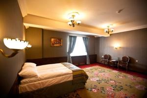 Posteľ alebo postele v izbe v ubytovaní Hotel Złoty Młyn Majków
