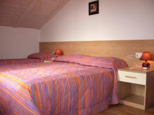 Łóżko lub łóżka w pokoju w obiekcie Casa Rondine