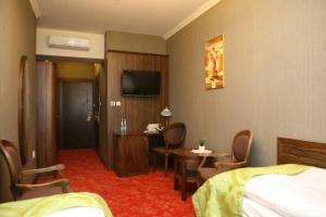 Posteľ alebo postele v izbe v ubytovaní Hotel Złoty Młyn Majków