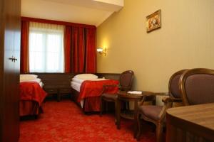 Posteľ alebo postele v izbe v ubytovaní Hotel Złoty Młyn Majków