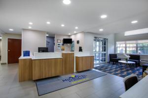 an office with a lobby with a reception desk at Microtel Inn & Suites by Wyndham Burlington in Burlington