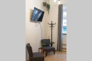 TV a/nebo společenská místnost v ubytování Cosy and Spacious Apartment in the heart of Innsbruck