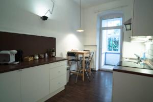 A cozinha ou cozinha compacta de Cosy and Spacious Apartment in the heart of Innsbruck