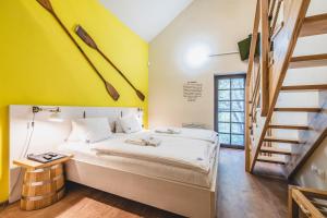 A bed or beds in a room at Hotel Resort Relax