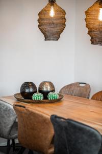 a table with a plate of spheres on it at New Bay in Callantsoog