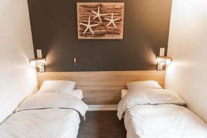 Кровать или кровати в номере New Bay