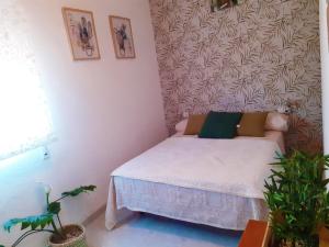 Łóżko lub łóżka w pokoju w obiekcie Casa Rural La Milla Verde