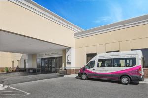 a white van is parked in front of a building at Crowne Plaza Greenville, an IHG Hotel in Greenville