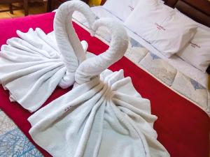 Postel nebo postele na pokoji v ubytování Hotel El Farolito