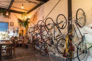 a bunch of bikes hanging on a wall at BIKE & BED EAST TOKYO private villa 160sqm 自転車のある一棟貸切宿 in Tokyo