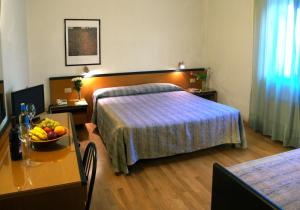 Cama o camas de una habitación en Hotel Nuova Grosseto
