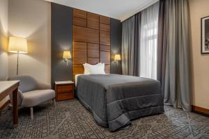 Postel nebo postele na pokoji v ubytování CITYHOTEL