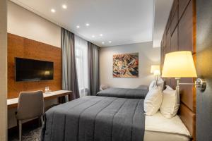 Postel nebo postele na pokoji v ubytování CITYHOTEL