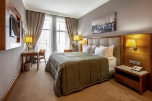 Postel nebo postele na pokoji v ubytování CITYHOTEL