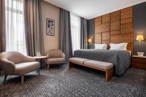 Postel nebo postele na pokoji v ubytování CITYHOTEL + 27 fotografií
