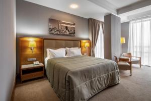 Postel nebo postele na pokoji v ubytování CITYHOTEL