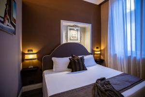 Posteľ alebo postele v izbe v ubytovaní JB Relais- Campo de' Fiori