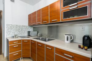 Kuchyňa alebo kuchynka v ubytovaní Sleepway Apartments - Garbary 95-112a