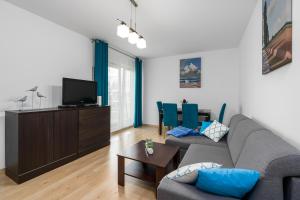 Televízia a/alebo spoločenská miestnosť v ubytovaní Sleepway Apartments - Garbary 95-112a