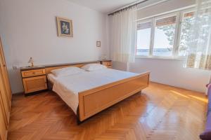 Postel nebo postele na pokoji v ubytování Apartman Sonja