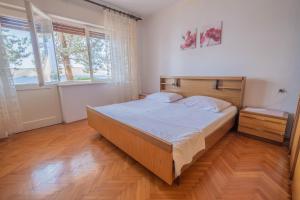 Postel nebo postele na pokoji v ubytování Apartman Sonja